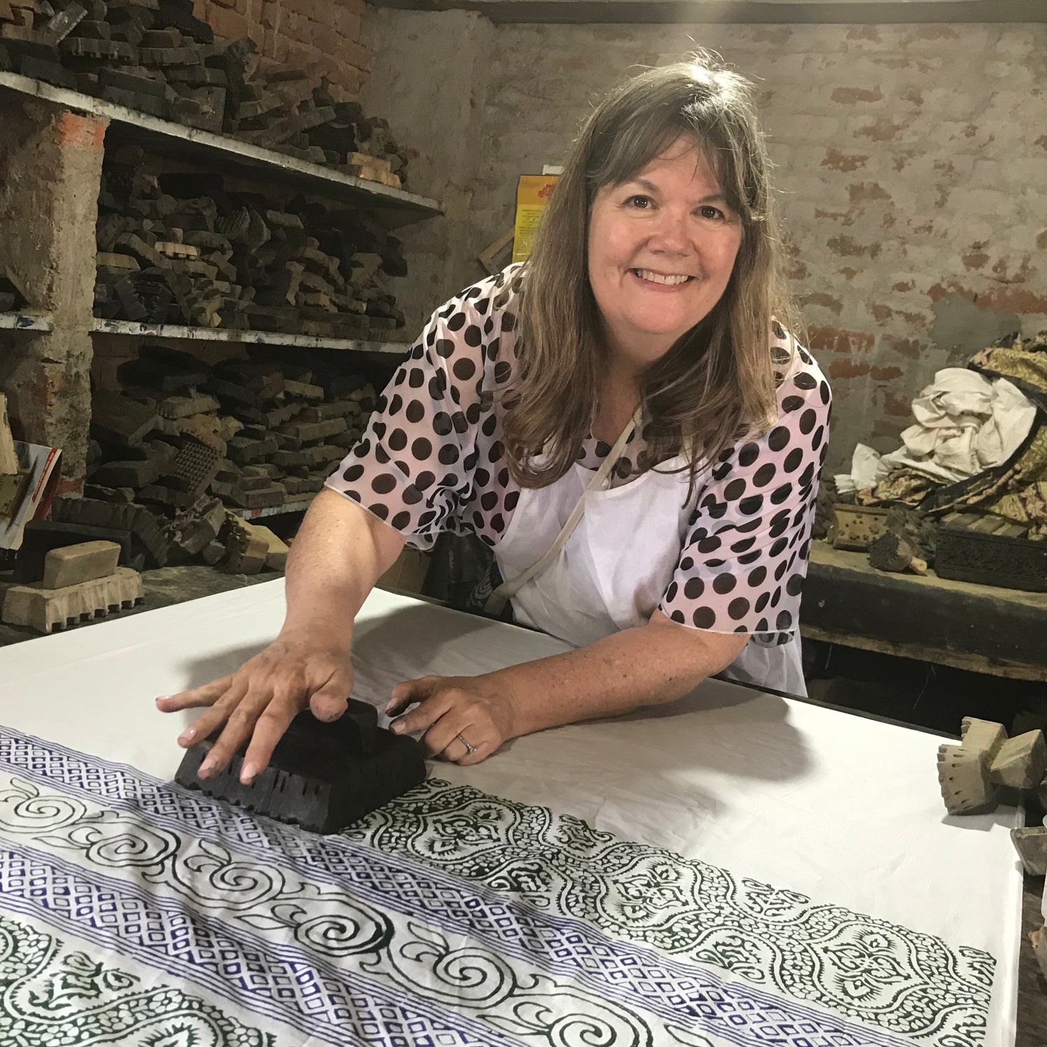 Textile Artist Kathy Barlow, block printing during a tour of the Jaipur, India area.